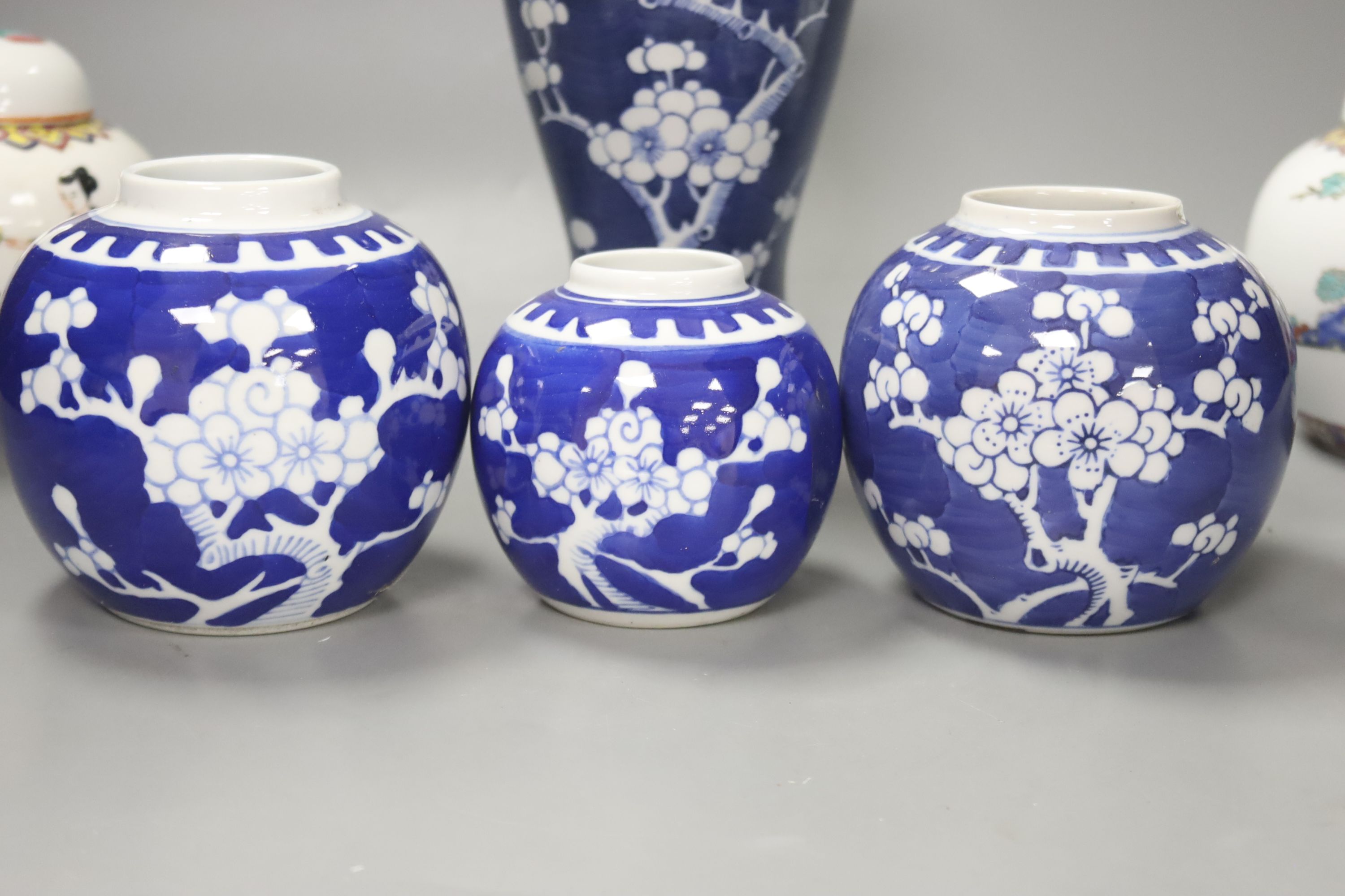 Two pairs of Chinese jars, one pair with covers, two other jars and a blue and white vase and cover, height 26cm